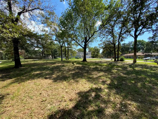 a view of field with trees