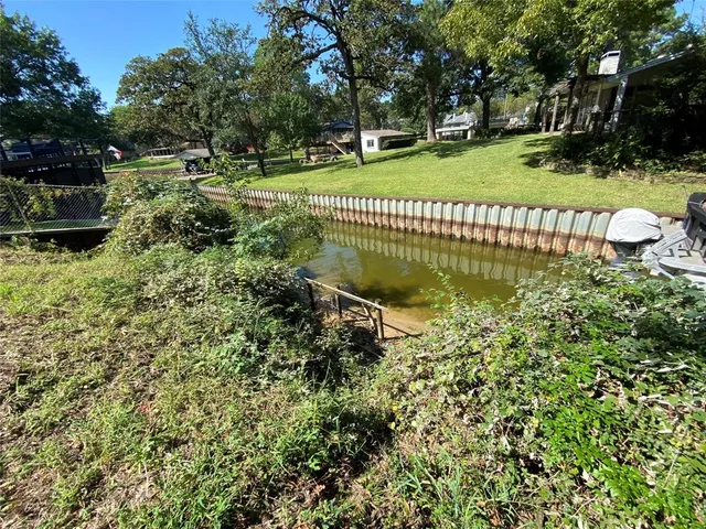 a garden view with a playing court