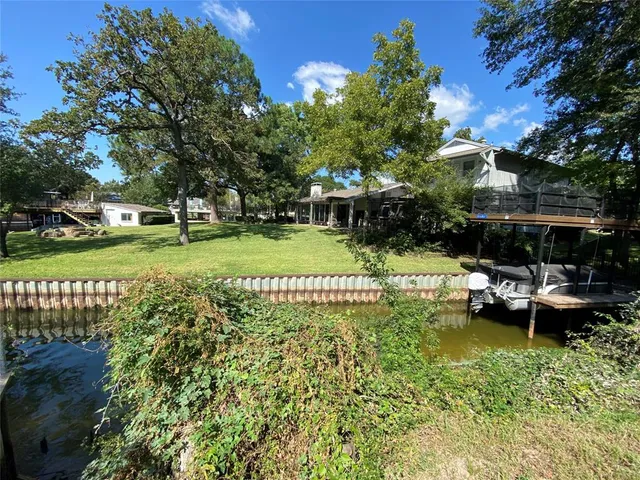 a view of a backyard with sitting area