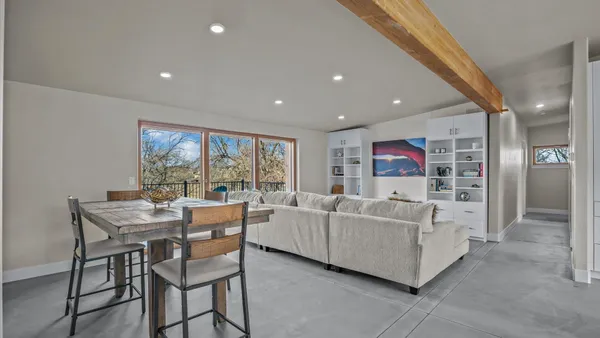 a kitchen with stainless steel appliances a refrigerator and a stove top oven