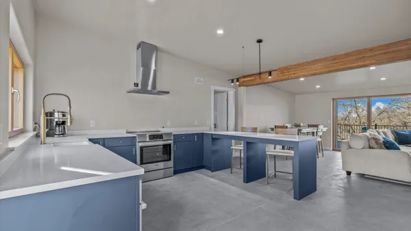 a kitchen with a table and chairs in it
