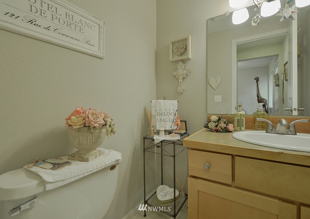 805 North 33rd Place Renton, WA 98056 - Photo 14 of 24 a bathroom with a sink vanity and toilet