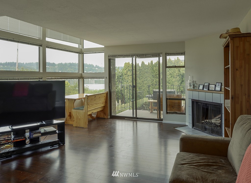 805 North 33rd Place Renton, WA 98056 - Photo 15 of 24 a living room with fireplace furniture and a flat screen tv