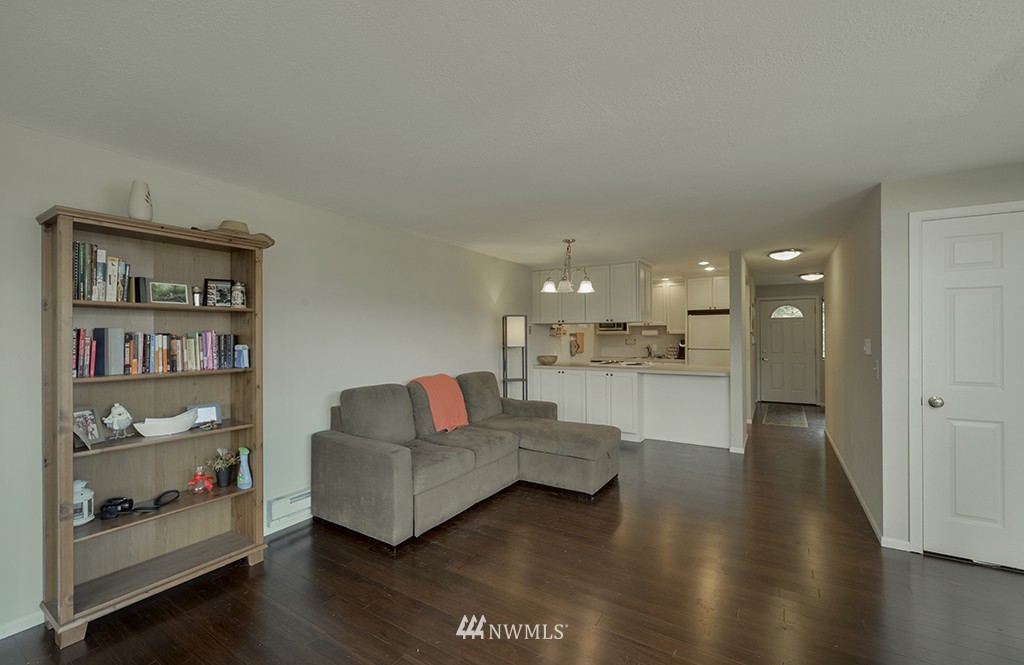 805 North 33rd Place Renton, WA 98056 - Photo 17 of 24 a living room with furniture and a book shelf