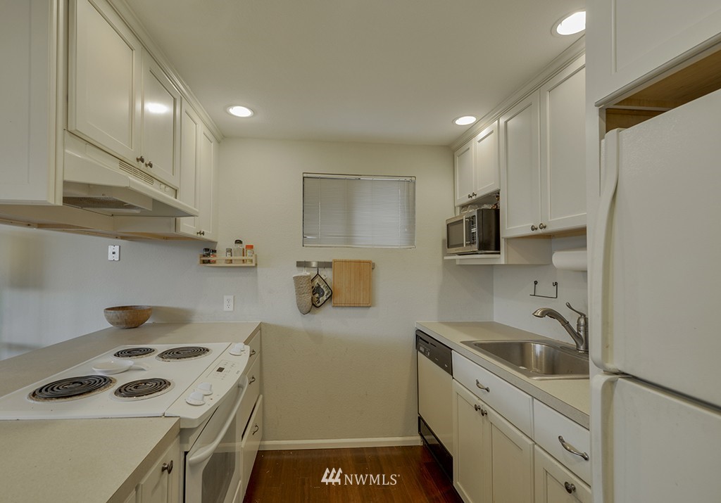 805 North 33rd Place Renton, WA 98056 - Photo 18 of 24 a kitchen with a sink a stove and refrigerator