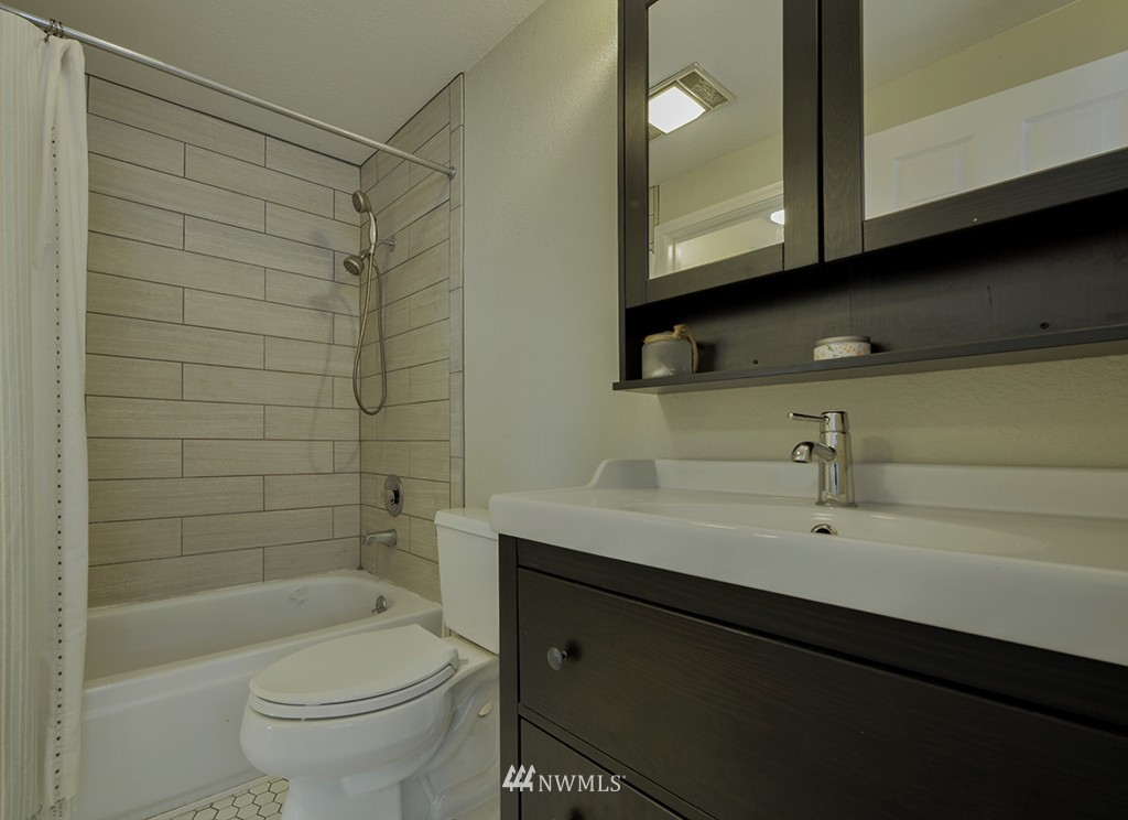805 North 33rd Place Renton, WA 98056 - Photo 21 of 24 a bathroom with a sink a toilet and shower