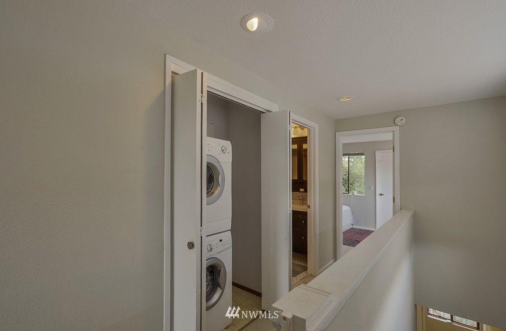 805 North 33rd Place Renton, WA 98056 - Photo 22 of 24 a view of a hallway with bathroom and shower