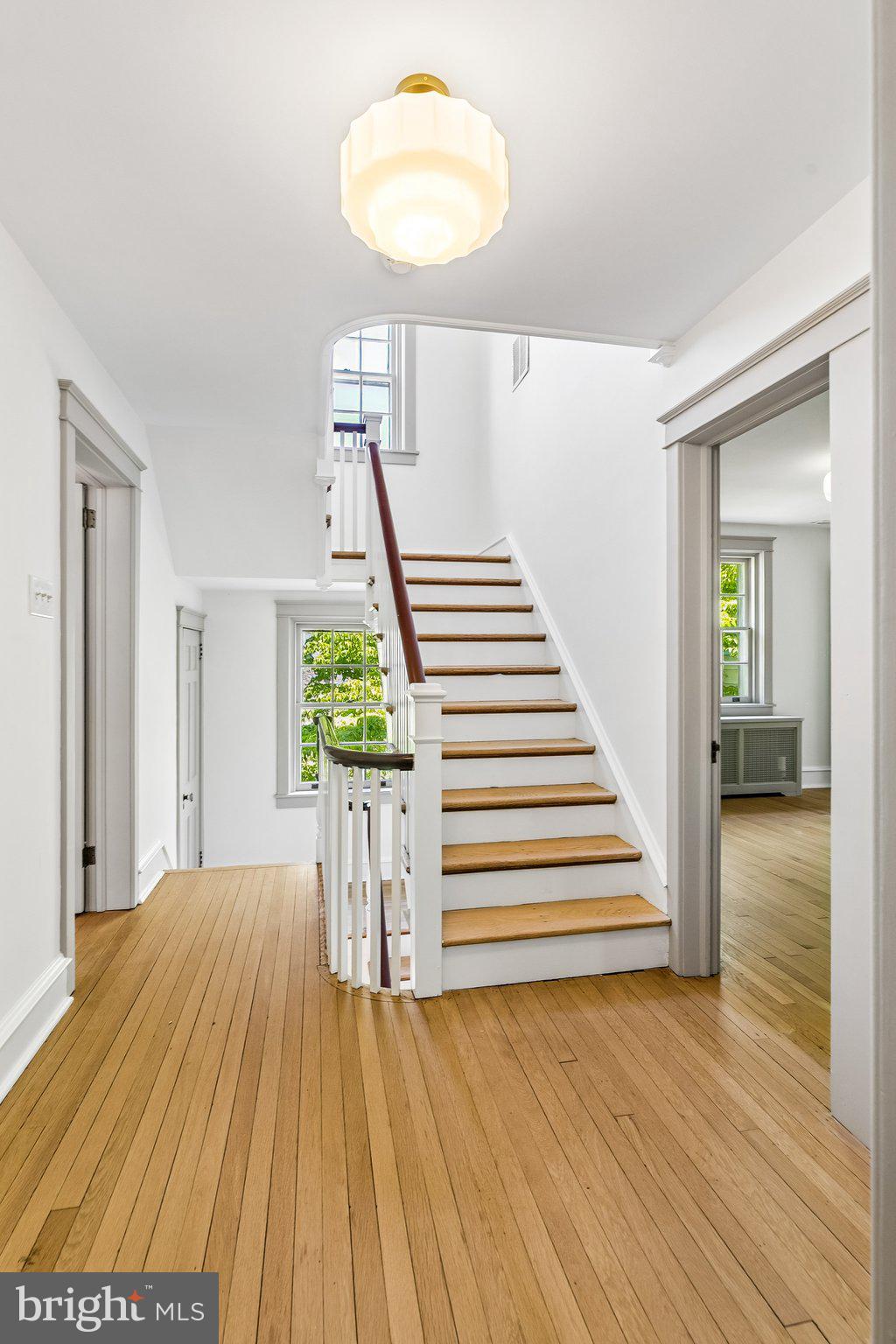 19 Farm Road Wayne, PA 19087 - Photo 28 of 50 a view of a livingroom with wooden floor and stairs