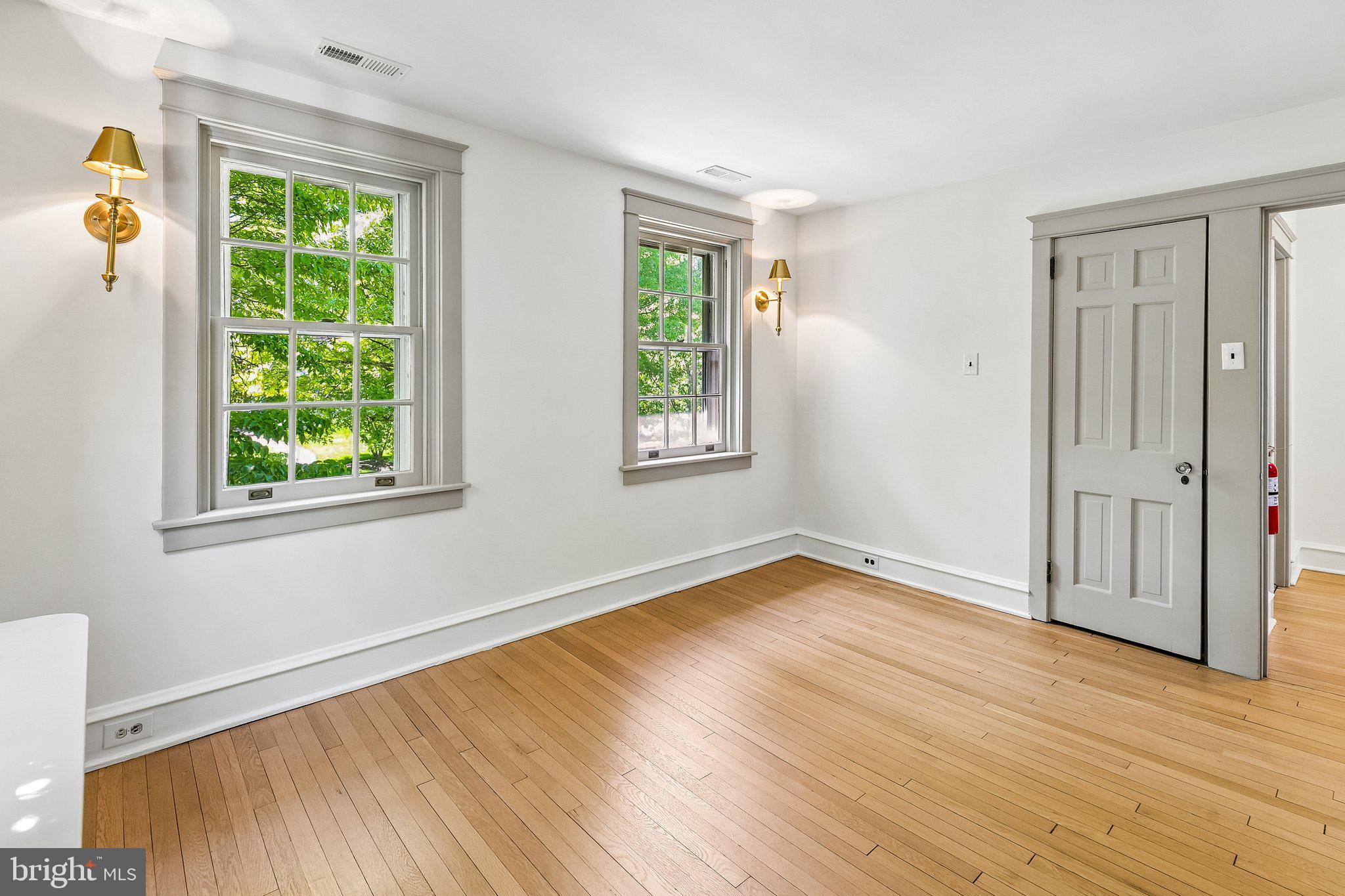 19 Farm Road Wayne, PA 19087 - Photo 29 of 50 a view of an empty room with wooden floor and a window
