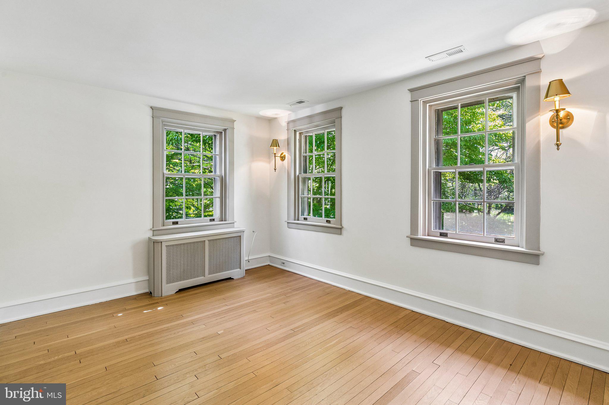19 Farm Road Wayne, PA 19087 - Photo 30 of 50 a view of an empty room with wooden floor and a window