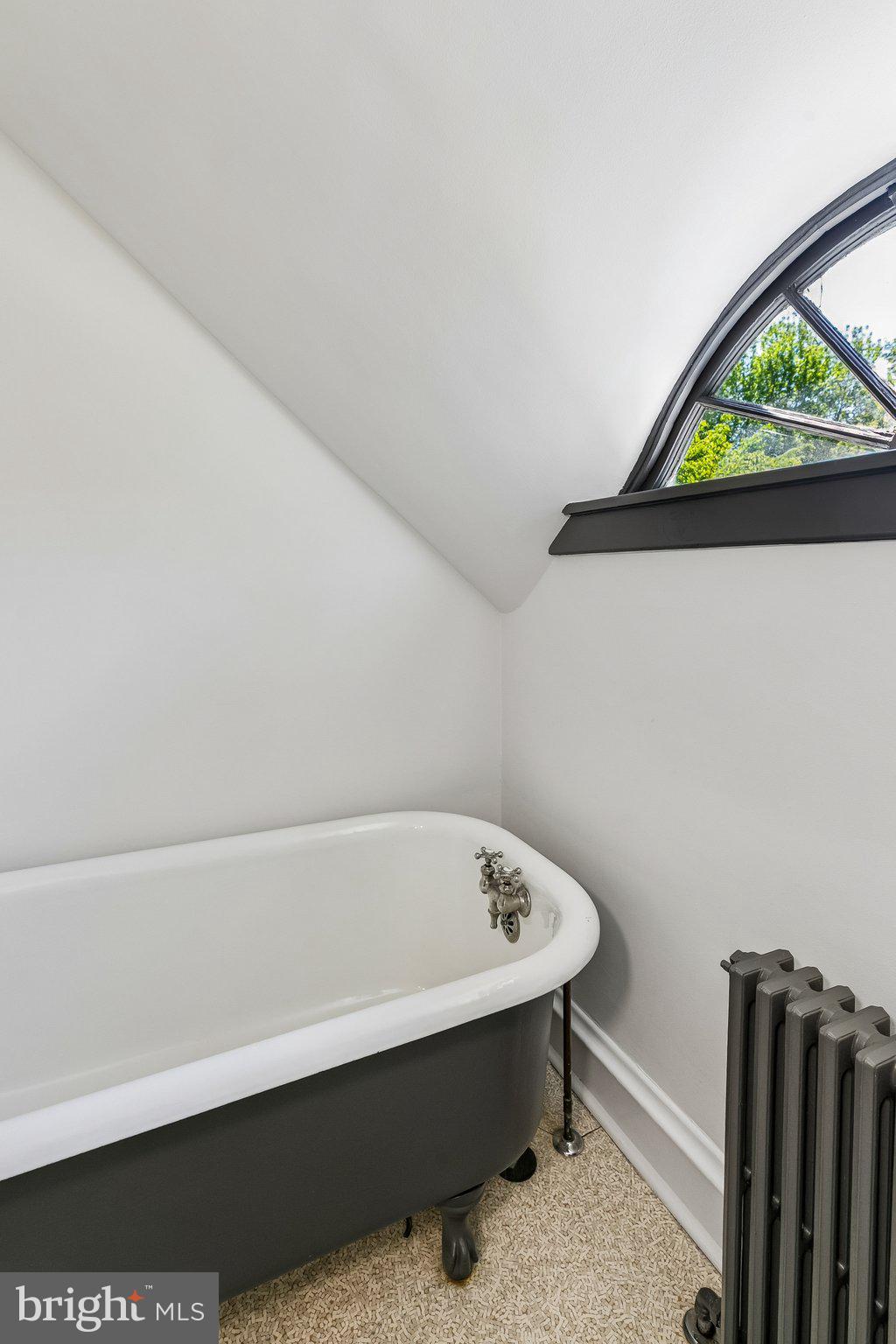 19 Farm Road Wayne, PA 19087 - Photo 39 of 50 a bathroom with a bathtub and a window