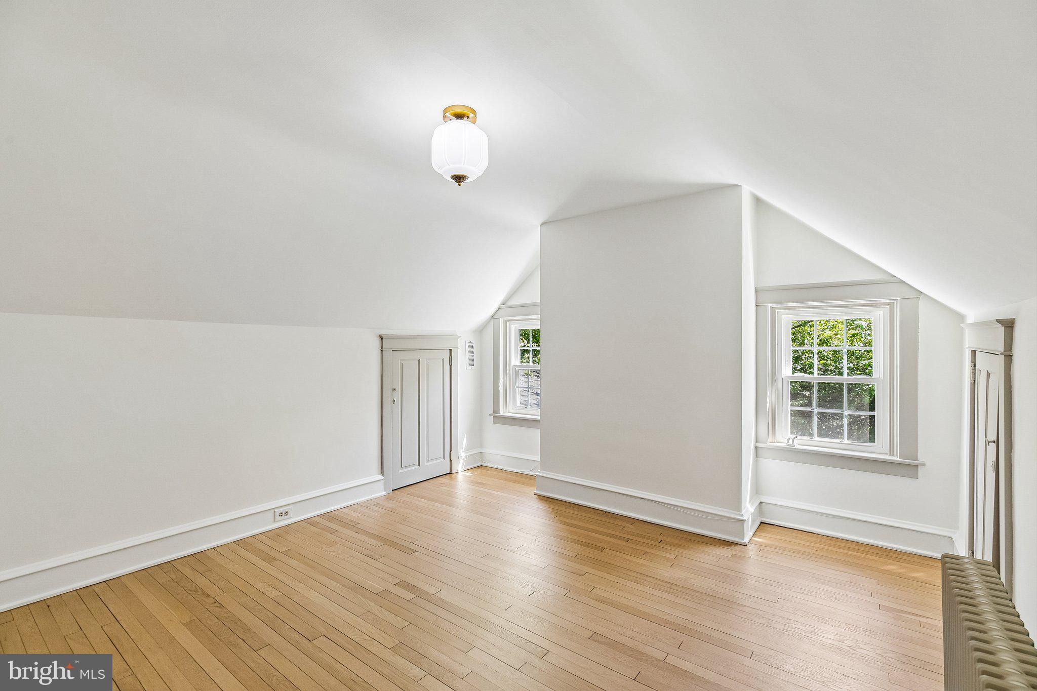 19 Farm Road Wayne, PA 19087 - Photo 41 of 50 an empty room with wooden floor and windows