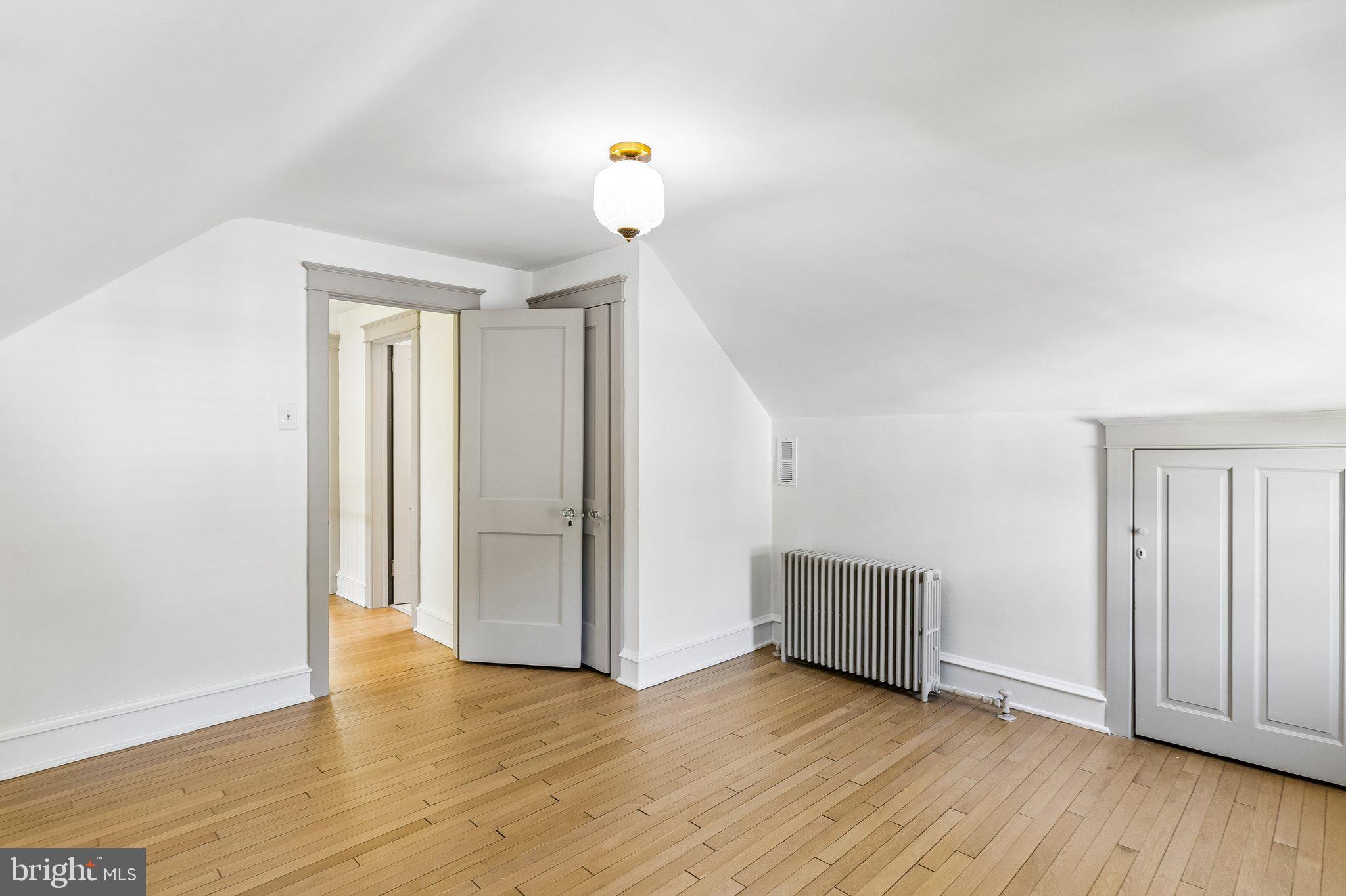 19 Farm Road Wayne, PA 19087 - Photo 45 of 50 an empty room with wooden floor and windows