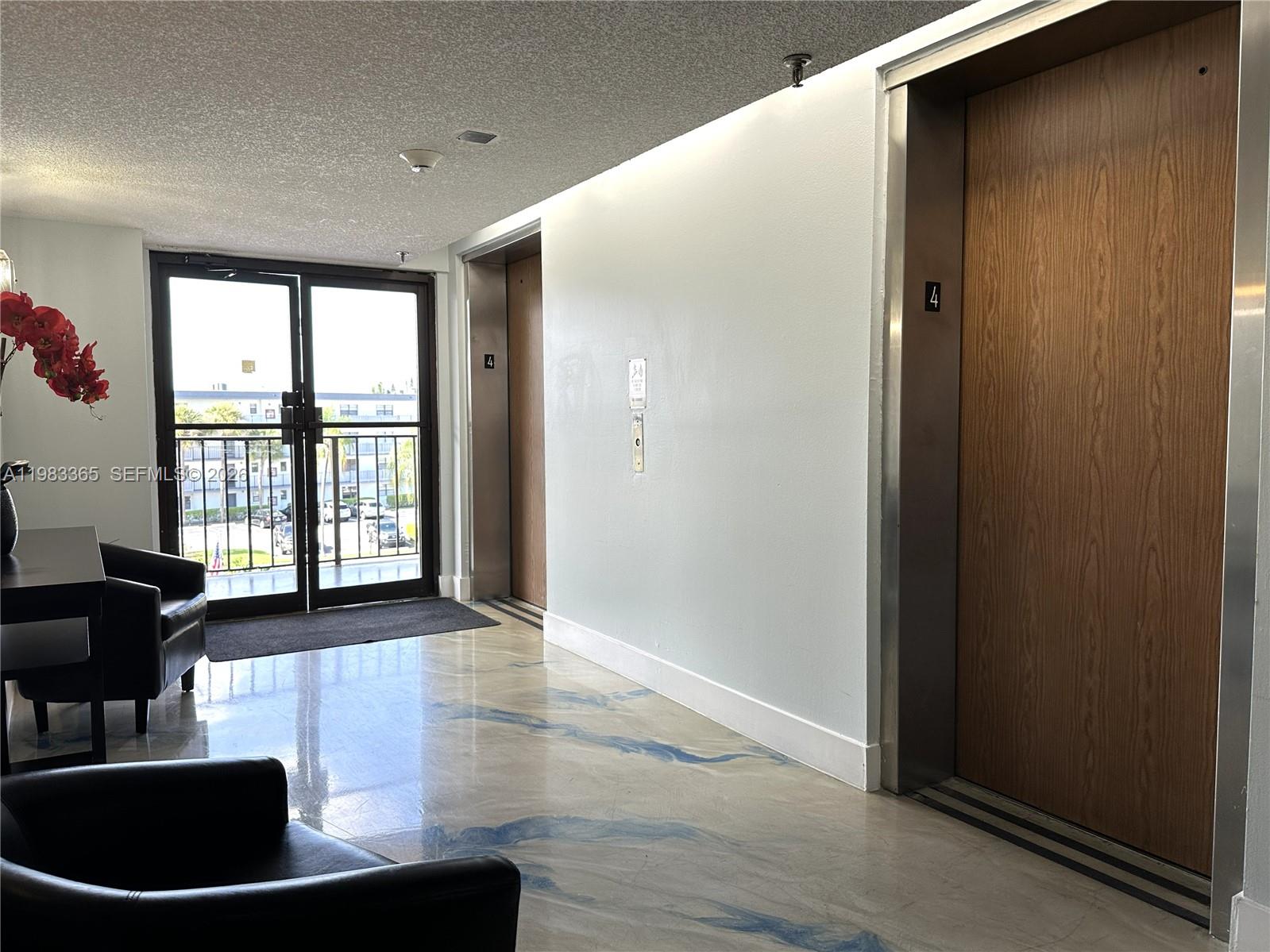 9370 Southwest 8th Street, Unit 423 Boca Raton, FL 33428 - Photo 13 of 14 Elevator Lobby