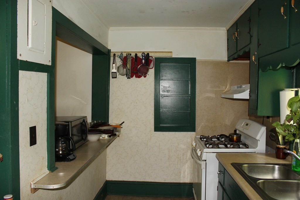 2081 Flint Road, Unit 2 Culloden, GA 31016 - Photo 7 of 7 a kitchen with a sink and refrigerator