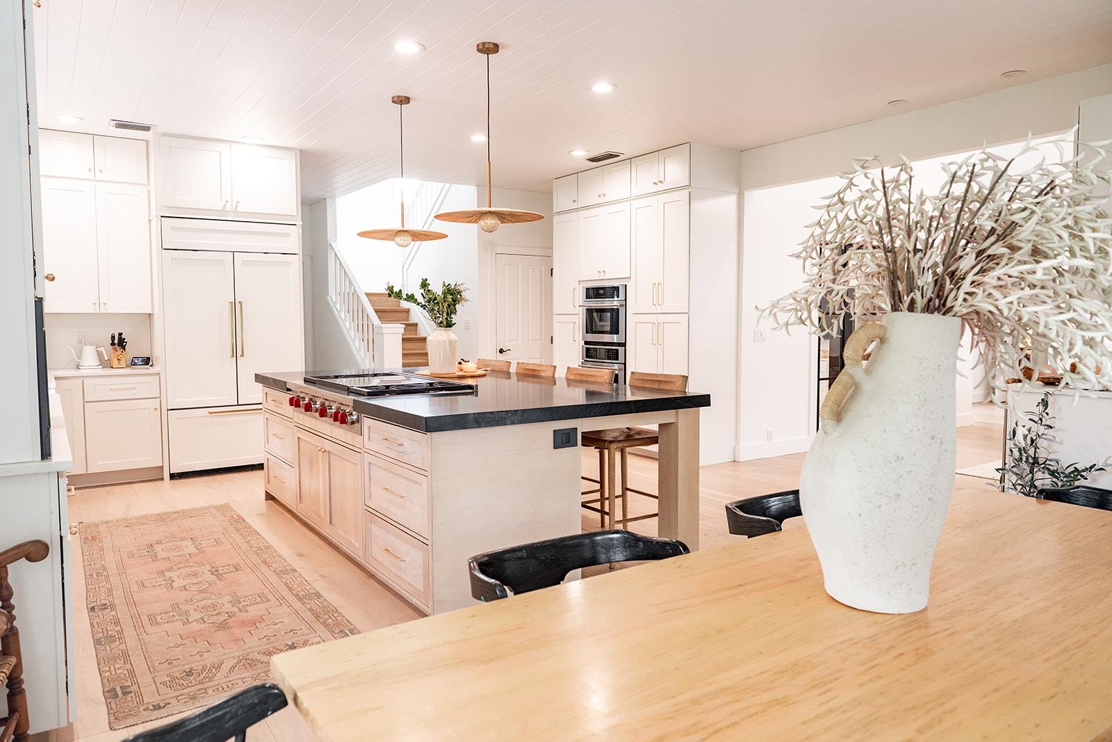 426 Marsh Point Circle St. Augustine, FL 32080 - Photo 19 of 87 a kitchen with stainless steel appliances kitchen island granite countertop a refrigerator a sink a stove and white cabinets