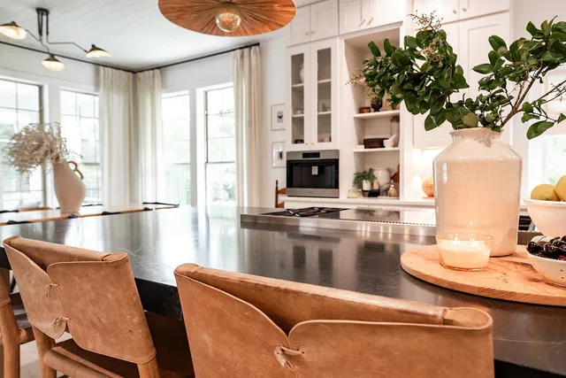 a view of a dining room with furniture and a window