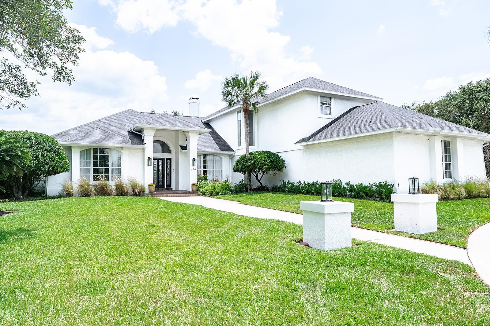 426 Marsh Point Circle St. Augustine, FL 32080 - Photo 3 of 87 a front view of a house with a yard and trees