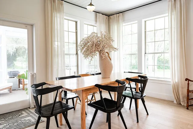 a living room with furniture and potted plant