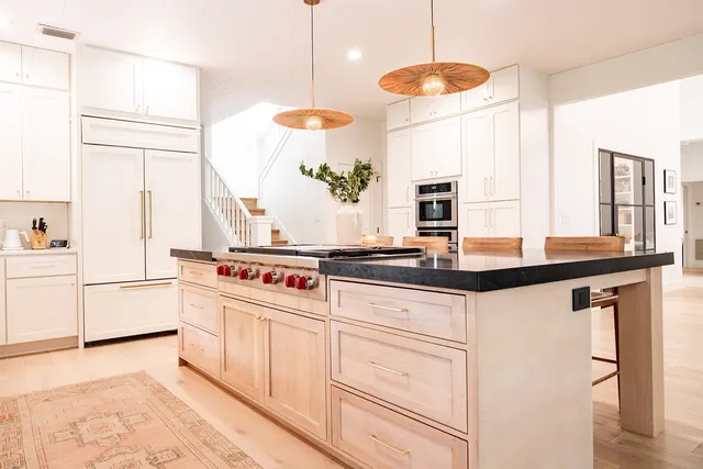 a bedroom with a bed and a night stand