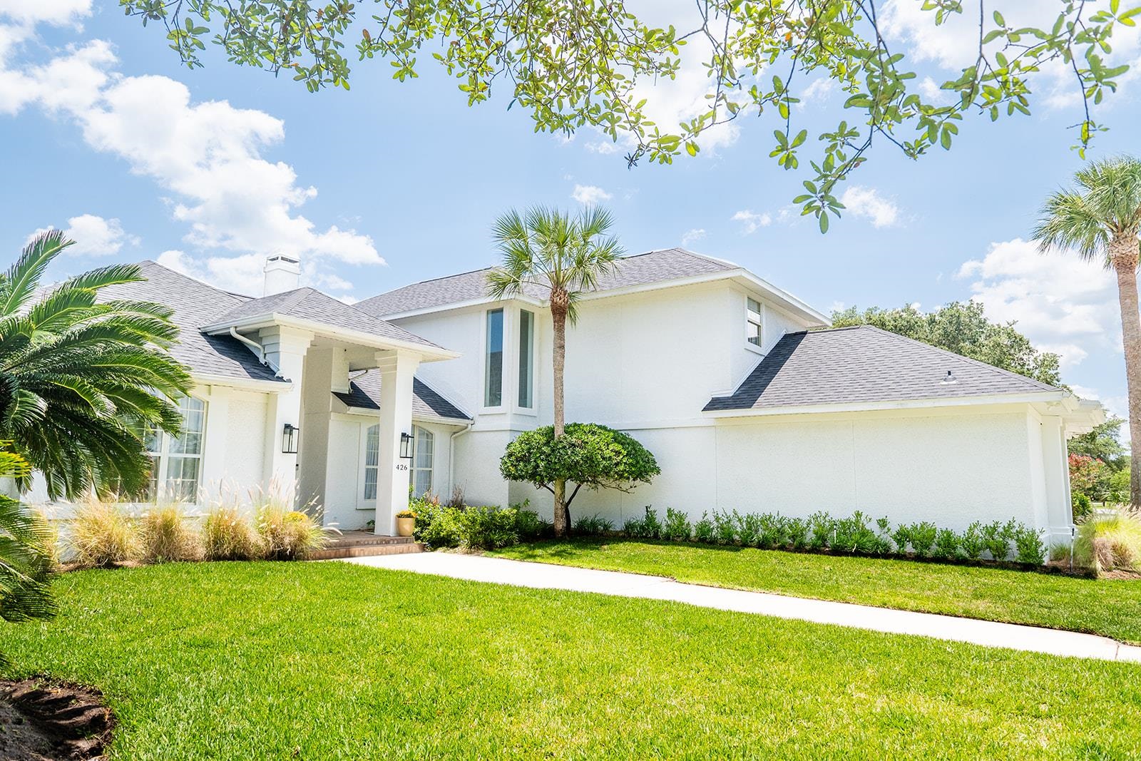 426 Marsh Point Circle St. Augustine, FL 32080 - Photo 4 of 87 a front view of a house with garden