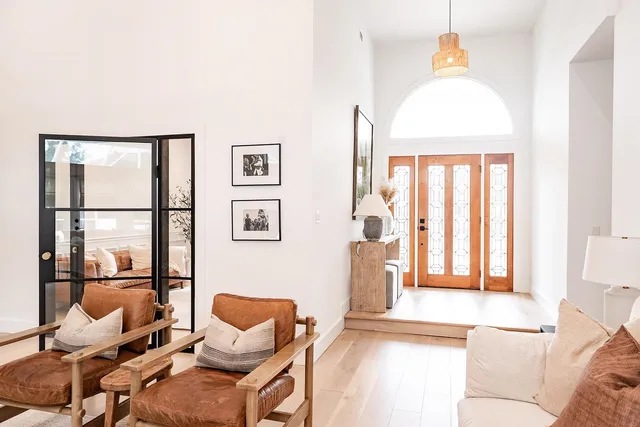 a living room with furniture couches and a fireplace