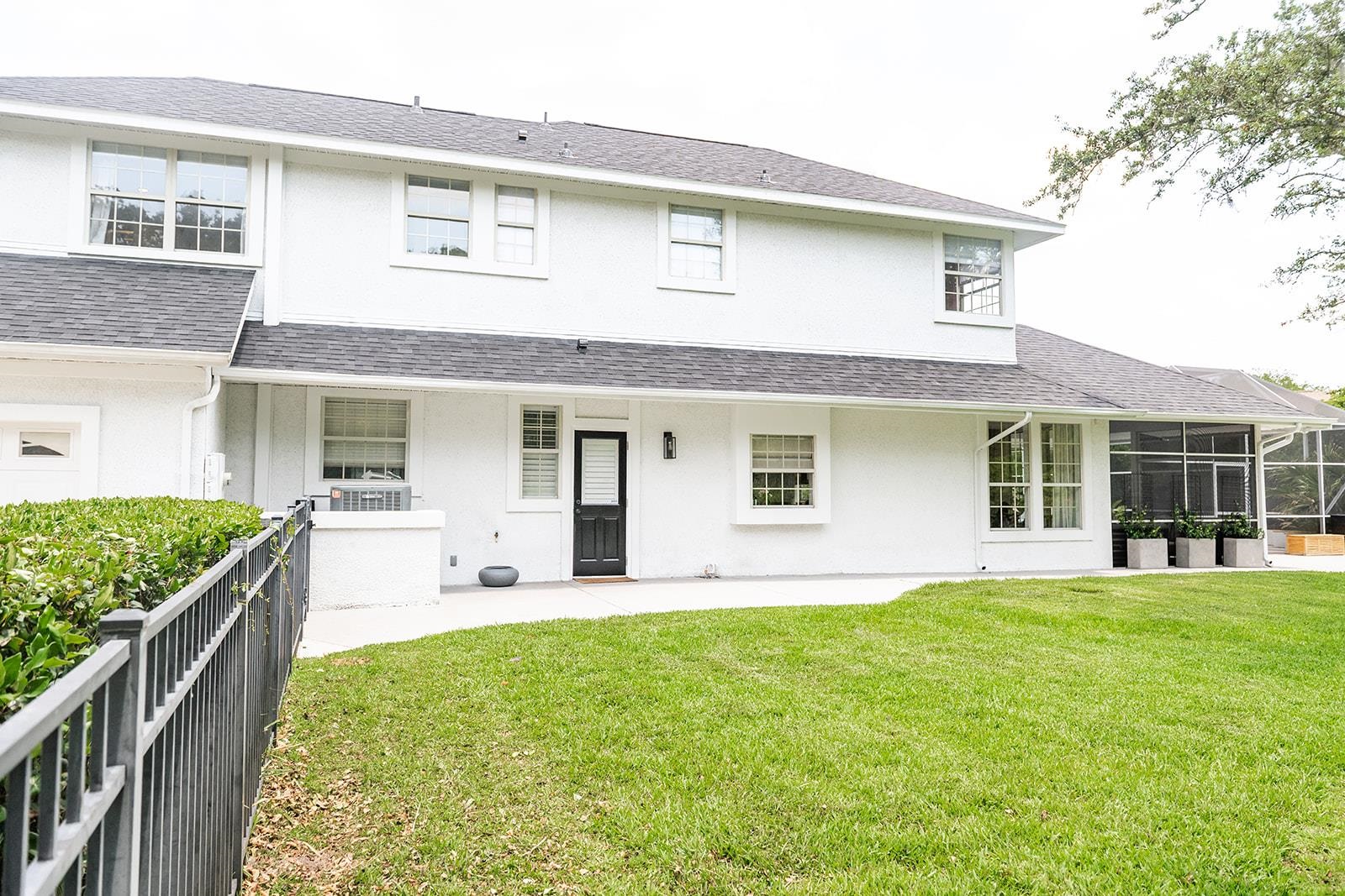 426 Marsh Point Circle St. Augustine, FL 32080 - Photo 86 of 87 a front view of a house with a yard and potted plants