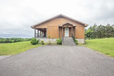 a balcony with furniture and a view of city
