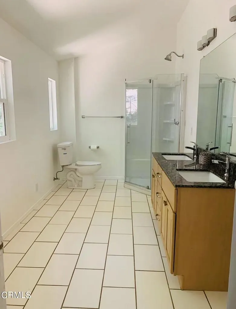 12266 Black Oak Drive Middletown, CA 95461 - Photo 7 of 12 a bathroom with a sink a toilet and mirror