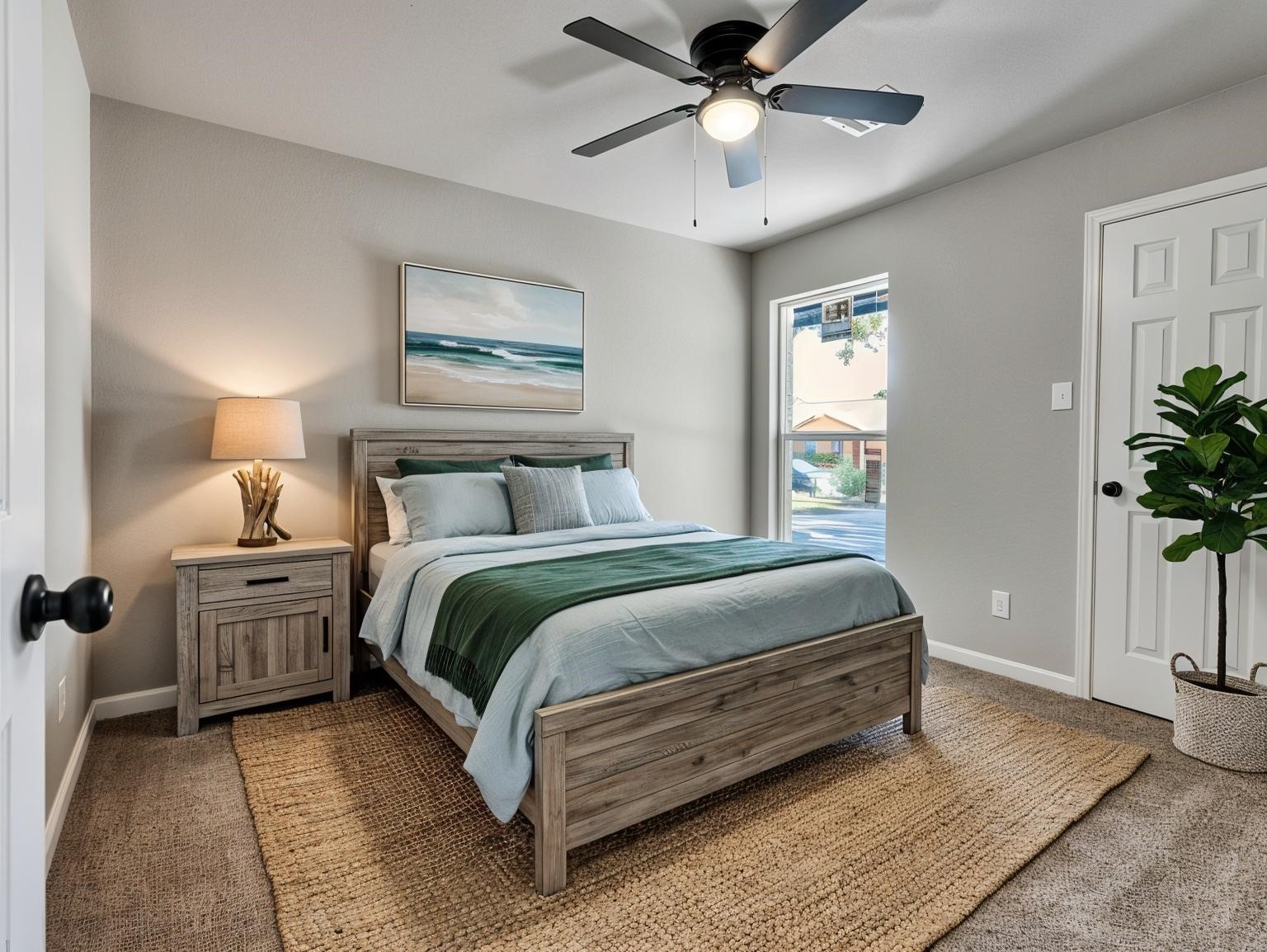 a bedroom with a bed and a potted plant