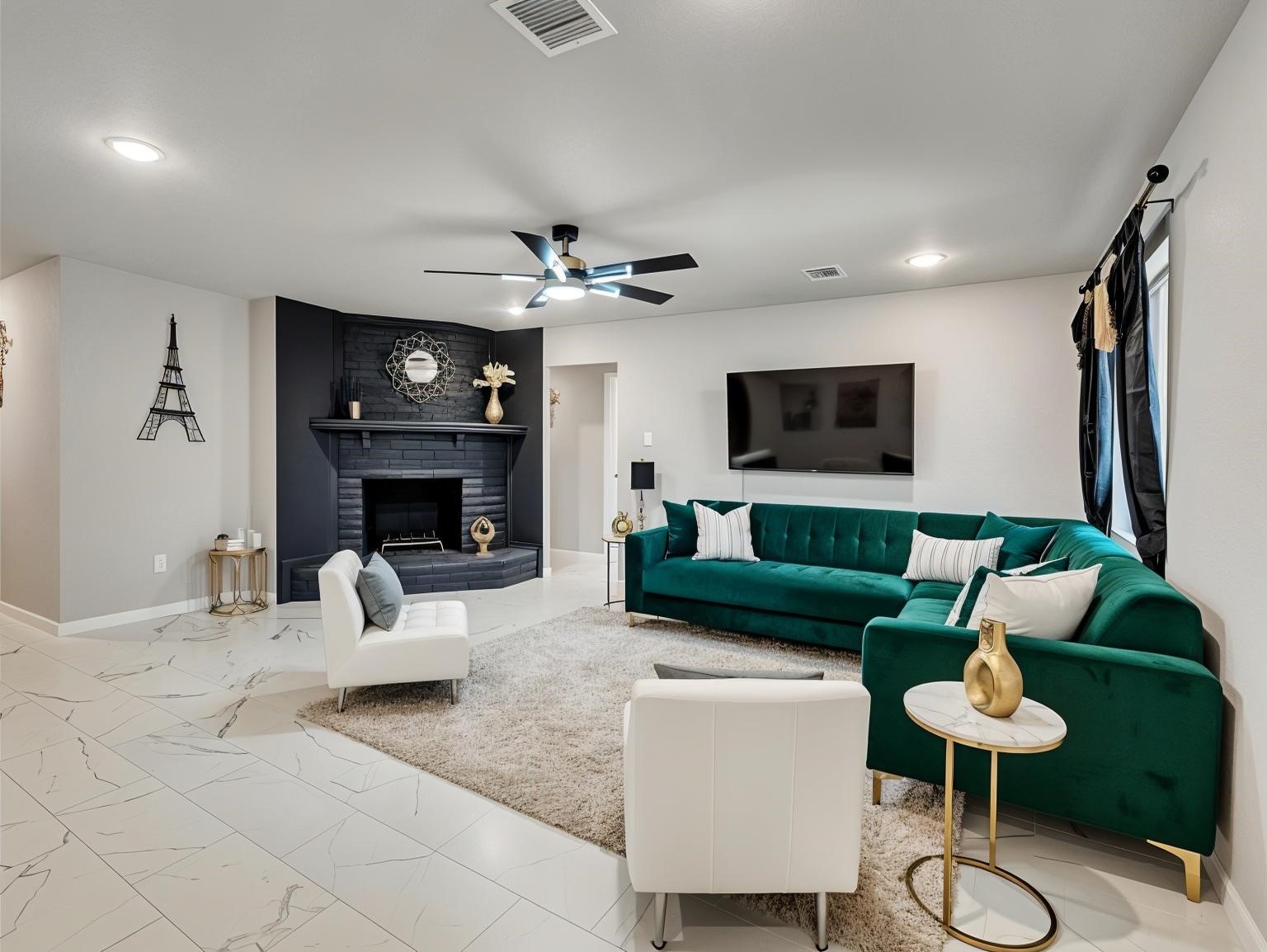 15123 Kaler Road Houston, TX 77060 - Photo 3 of 19 a living room with furniture a fireplace and a flat screen tv