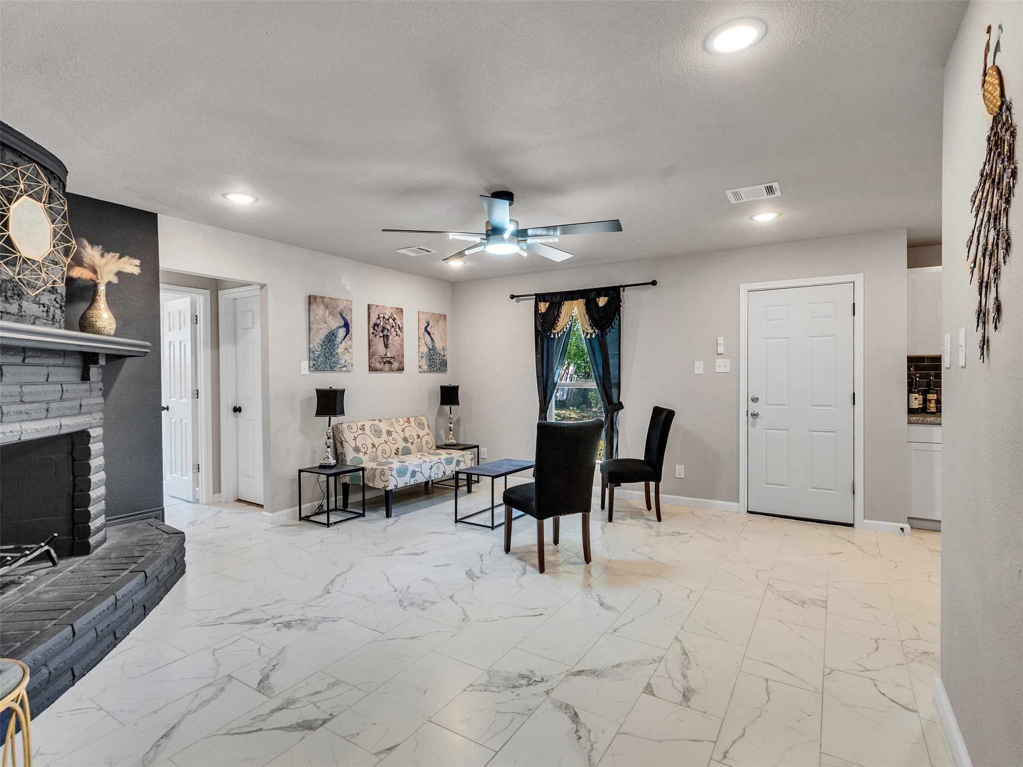 15123 Kaler Road Houston, TX 77060 - Photo 4 of 19 a living room with furniture and a fireplace