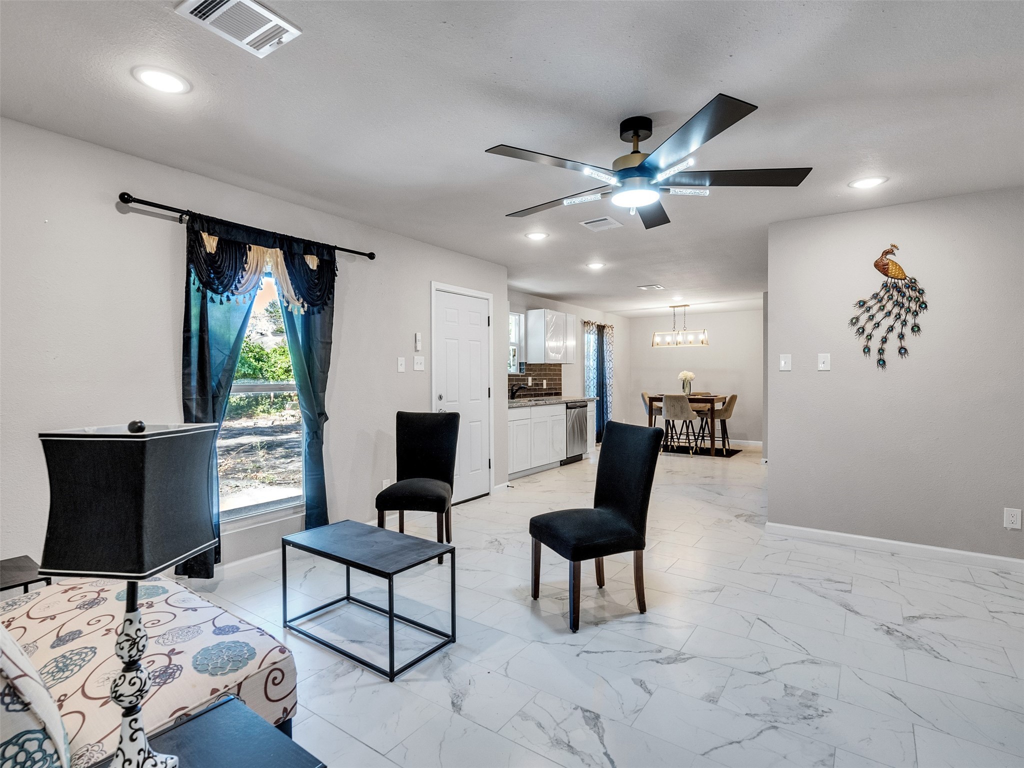 15123 Kaler Road Houston, TX 77060 - Photo 5 of 19 a living room with furniture and a window