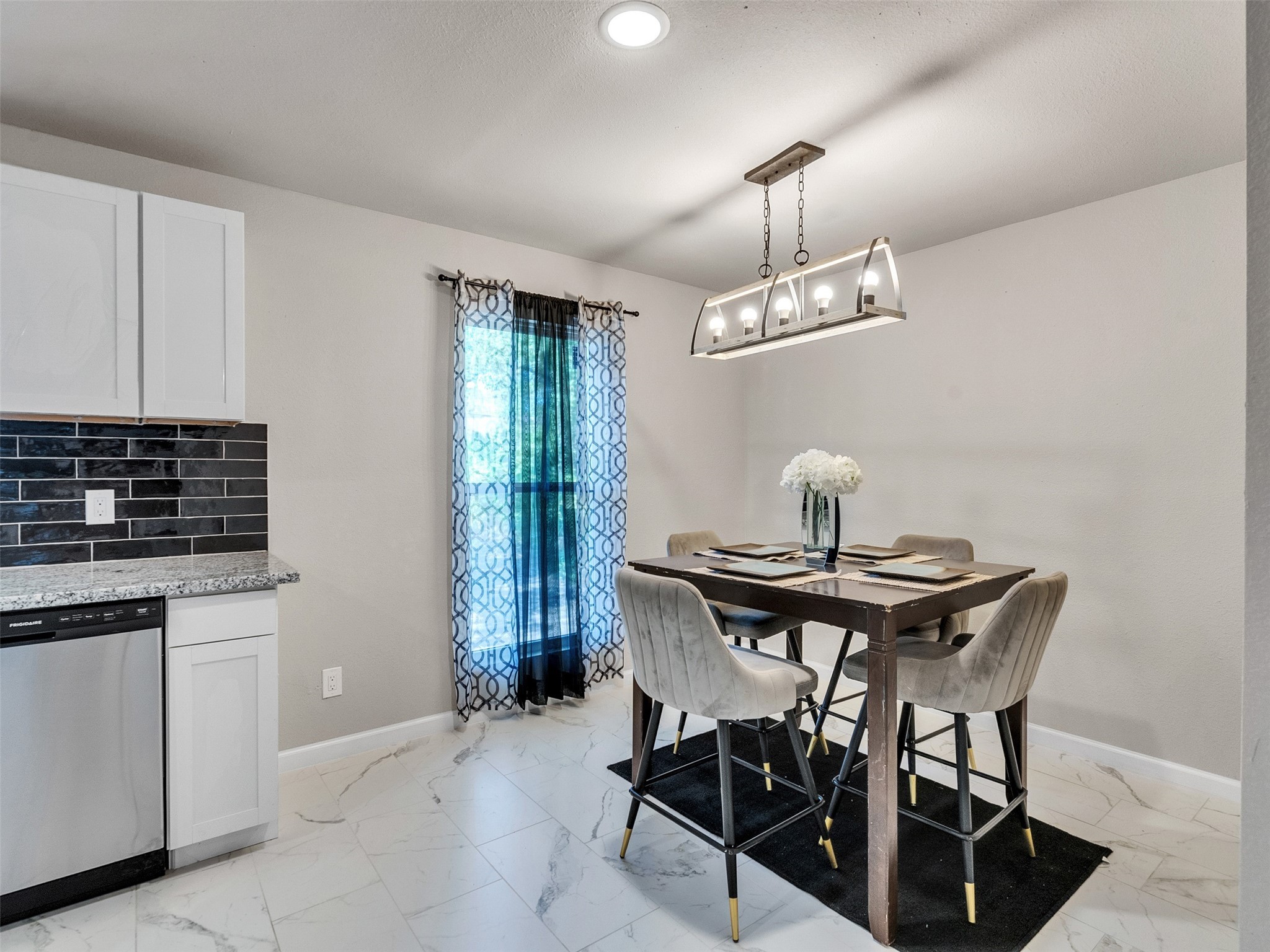 15123 Kaler Road Houston, TX 77060 - Photo 10 of 19 a view of a dining room with furniture and chandelier