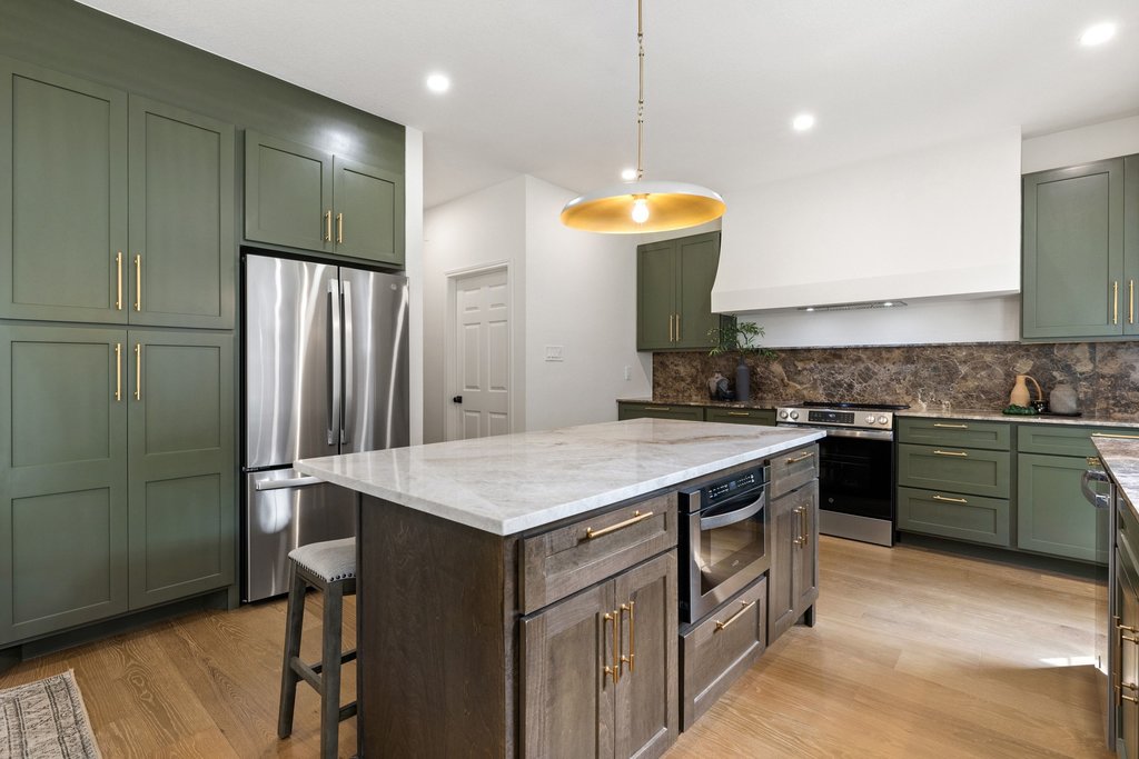 7516 Orrick Drive Austin, TX 78749 - Photo 15 of 40 a kitchen with a sink a counter space and stainless steel appliances