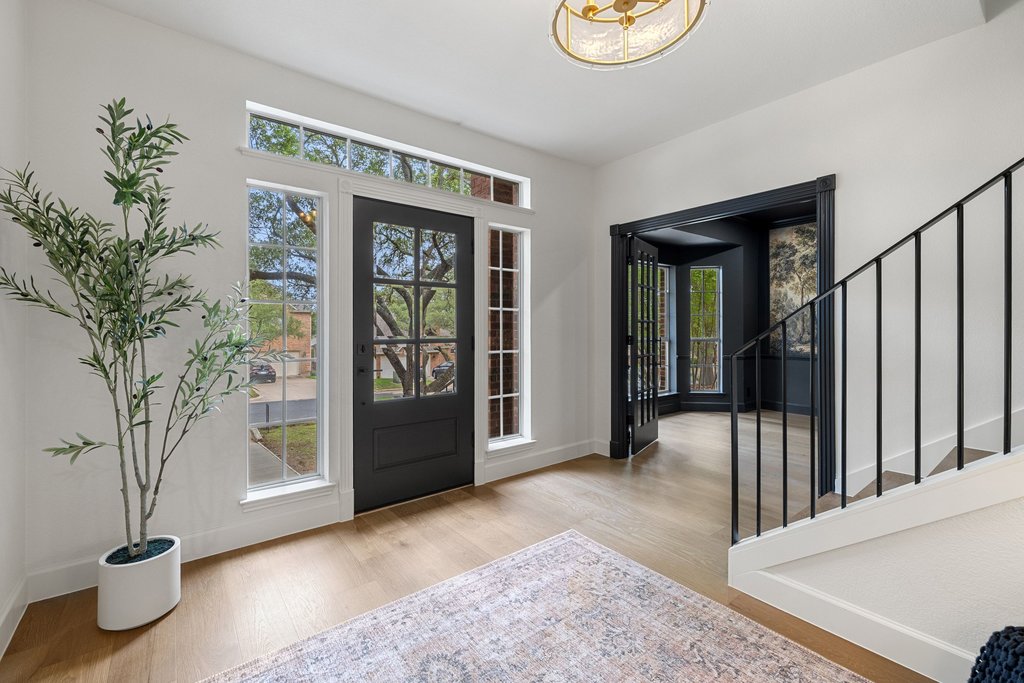 7516 Orrick Drive Austin, TX 78749 - Photo 2 of 40 a view of an entryway door and a potted plant