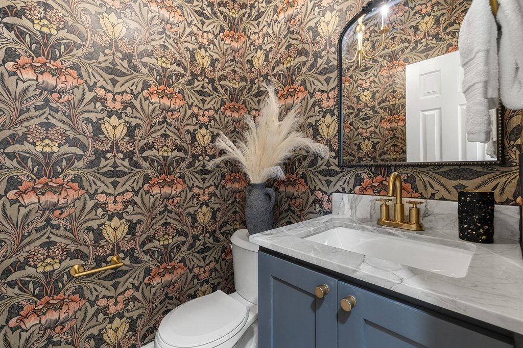 7516 Orrick Drive Austin, TX 78749 - Photo 25 of 40 a bathroom with a granite countertop sink and a toilet