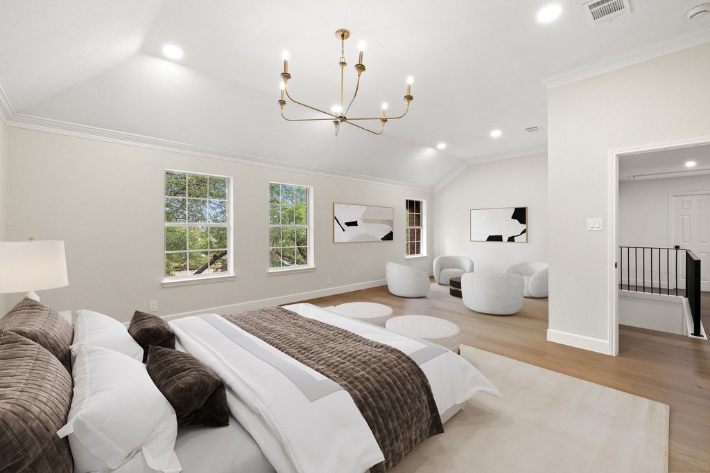 7516 Orrick Drive Austin, TX 78749 - Photo 26 of 40 a bedroom with a bed chandelier and a window