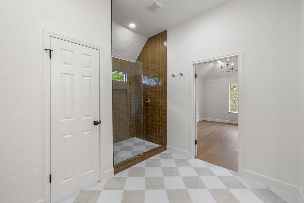 7516 Orrick Drive Austin, TX 78749 - Photo 30 of 40 a bathroom with a glass shower door