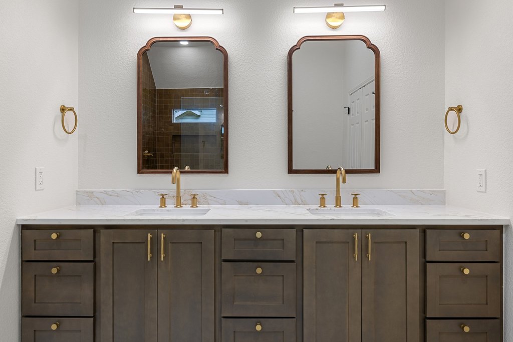 7516 Orrick Drive Austin, TX 78749 - Photo 31 of 40 a bathroom with double sink and two mirror