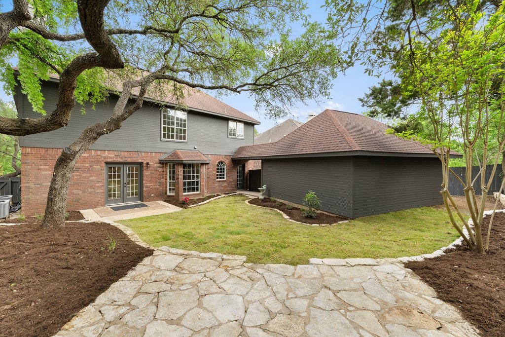 7516 Orrick Drive Austin, TX 78749 - Photo 38 of 40 a front view of a house with a yard