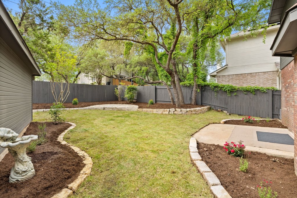 7516 Orrick Drive Austin, TX 78749 - Photo 39 of 40 a swimming pool with some trees in the background