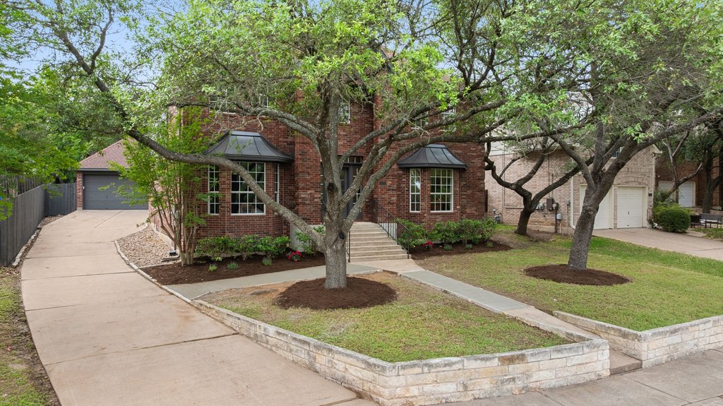 7516 Orrick Drive Austin, TX 78749 - Photo 40 of 40 a front view of a house with garden