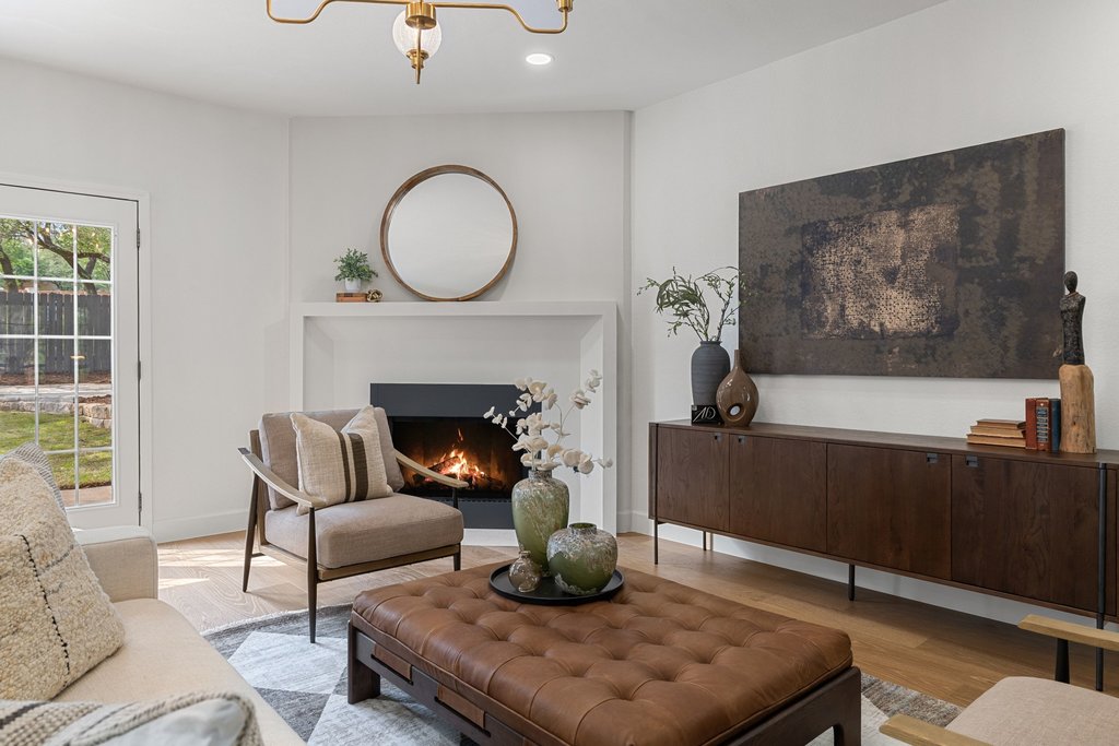 7516 Orrick Drive Austin, TX 78749 - Photo 10 of 40 a living room with furniture and a fireplace