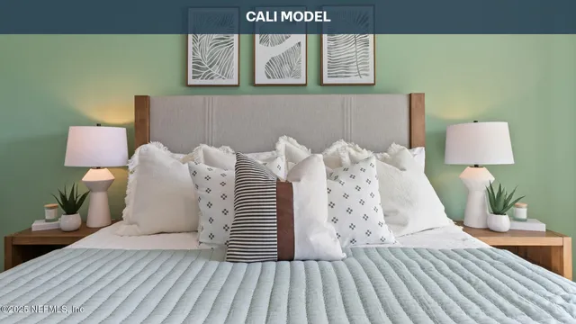 a bed room with a bed and a night stand