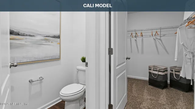 a bathroom with a toilet a sink and a shower