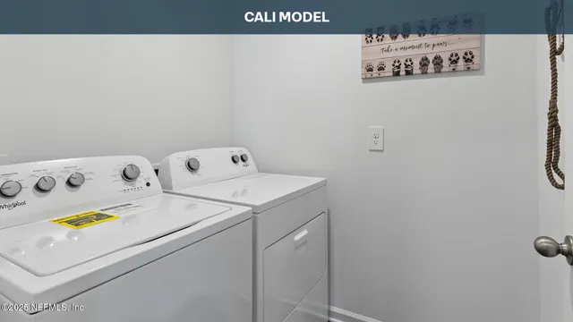 a utility room with dryer and washer