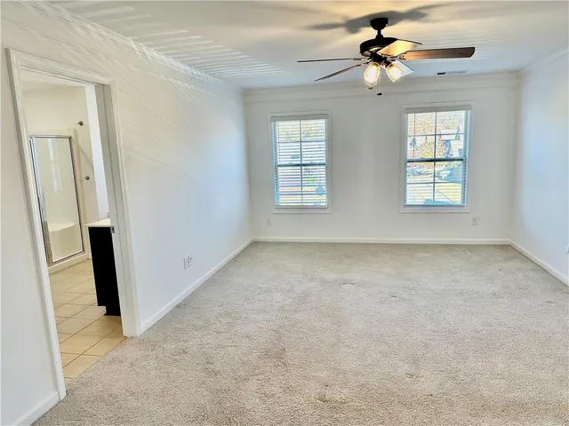 a view of bathroom with a tub and shower