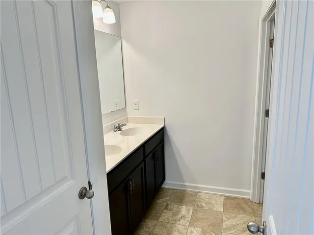 a bathroom with a sink a toilet and a bathtub