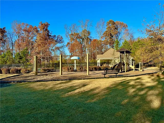 a front view of a house with swimming pool